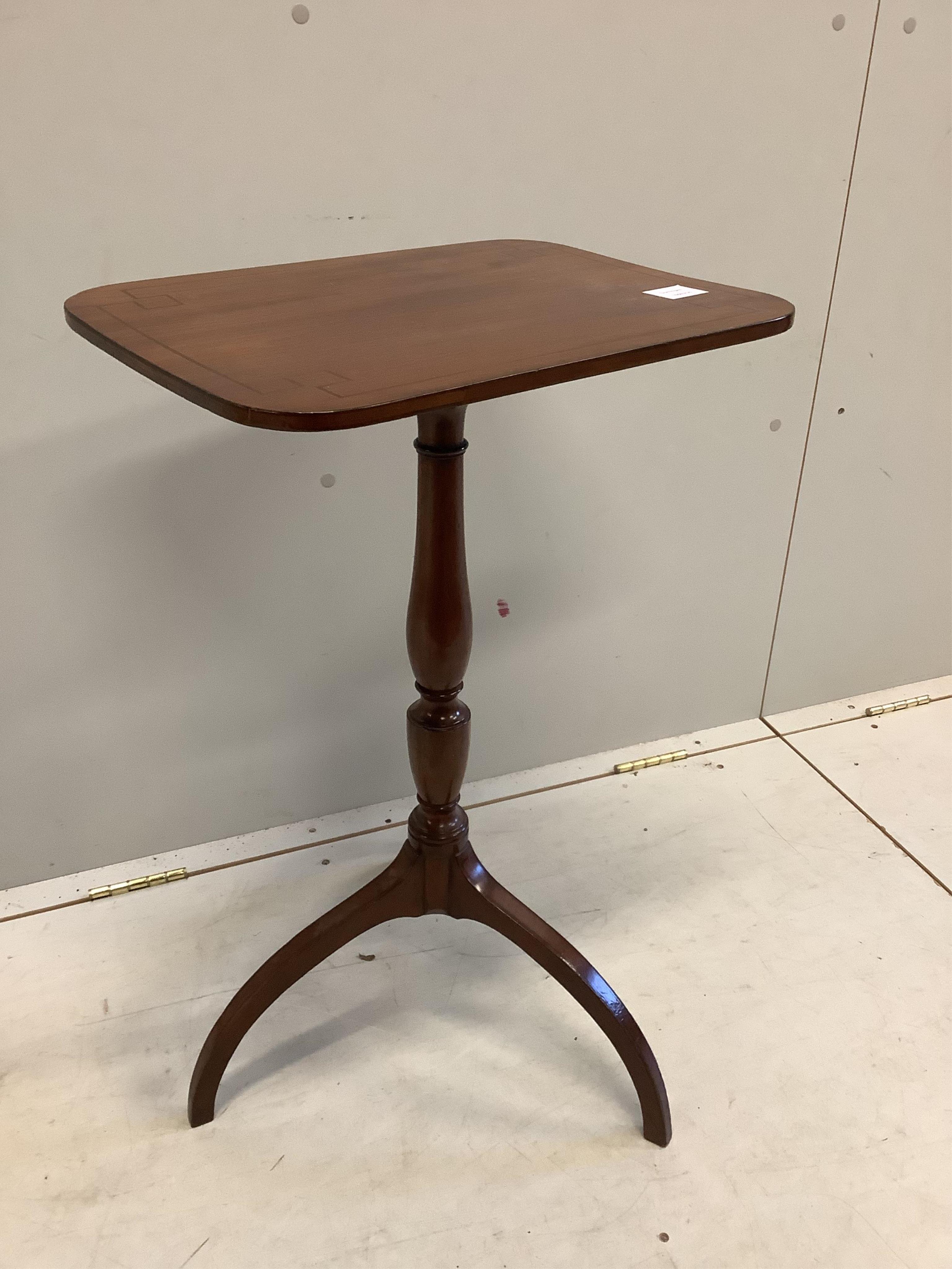 A Regency ebony strung mahogany tripod wine table on downswept legs, width 45cm, depth 33cm, height 72cm. Condition - fair, top marked and warped slightly.